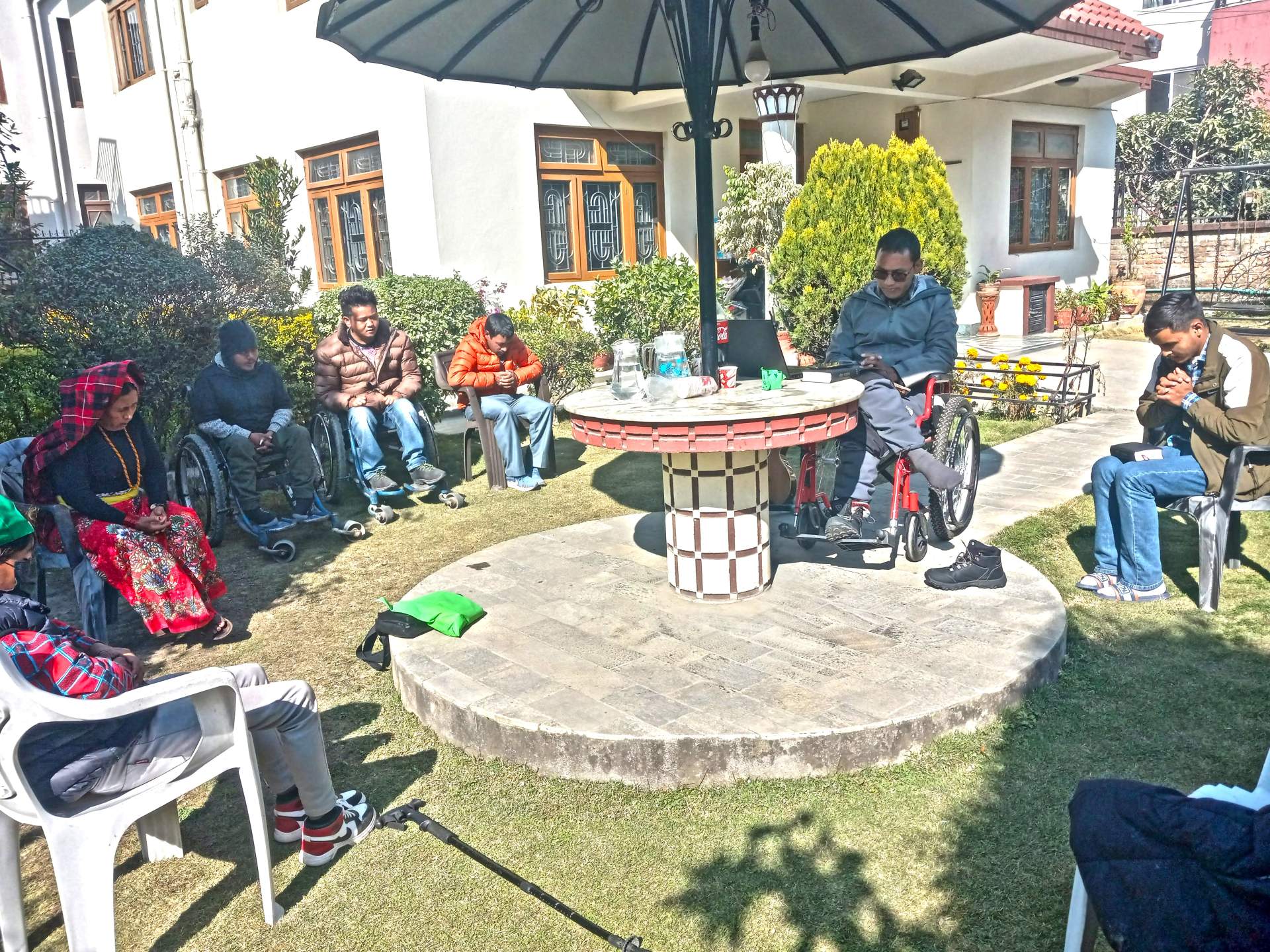 New believers gather in the yard where Phendey gives Bible lessons.
